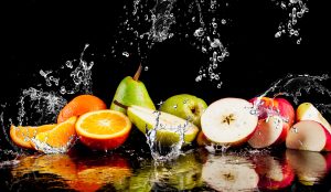 Pears, apples, orange fruits and Splashing water